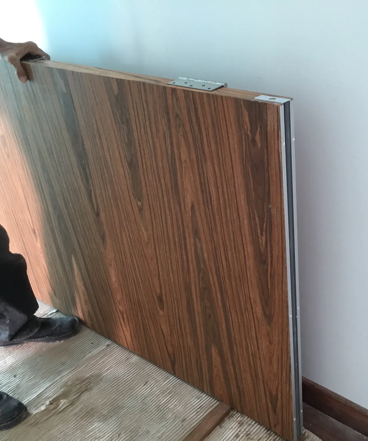 Solid core door retrofitted with an acoustic drop seal Solid core door retrofitted with an acoustic drop seal