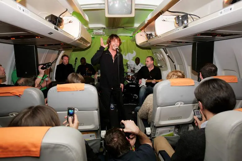 Jamiroquai perform on board a flight.